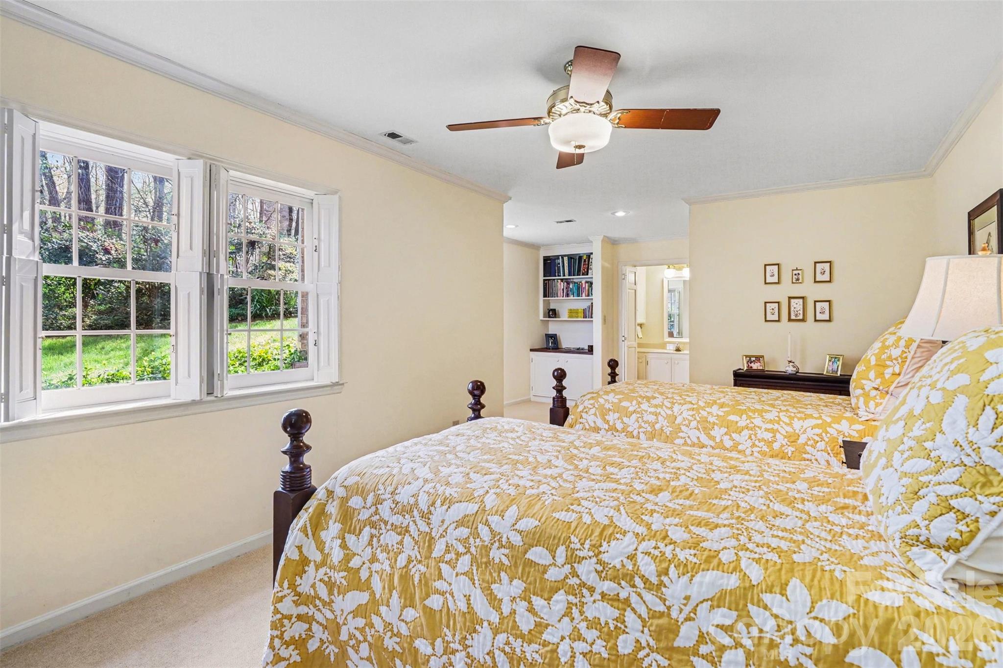 212 Deer Chase Road Shelby, NC 28150 - Photo 29 of 40 a bedroom with a bed and a chandelier