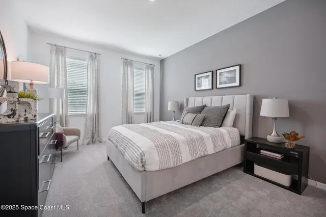 a bed room with a bed and a lamp