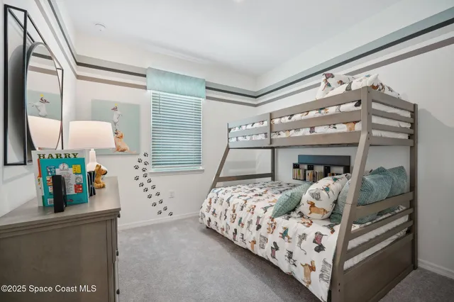 a bedroom with bed and a mirror