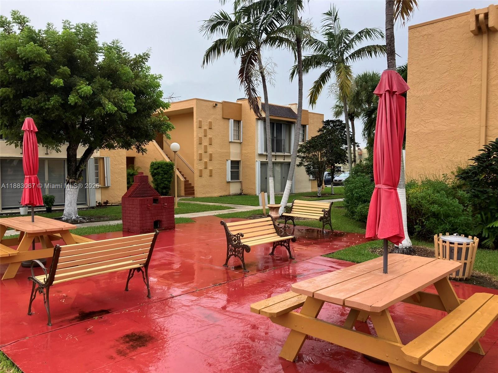 9311 Southwest 4th Street, Unit 104B Miami, FL 33174 - Photo 19 of 21 a view of backyard with swimming pool and sitting area