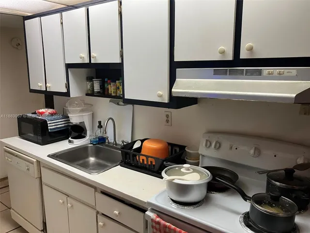 a kitchen with a stove and a sink