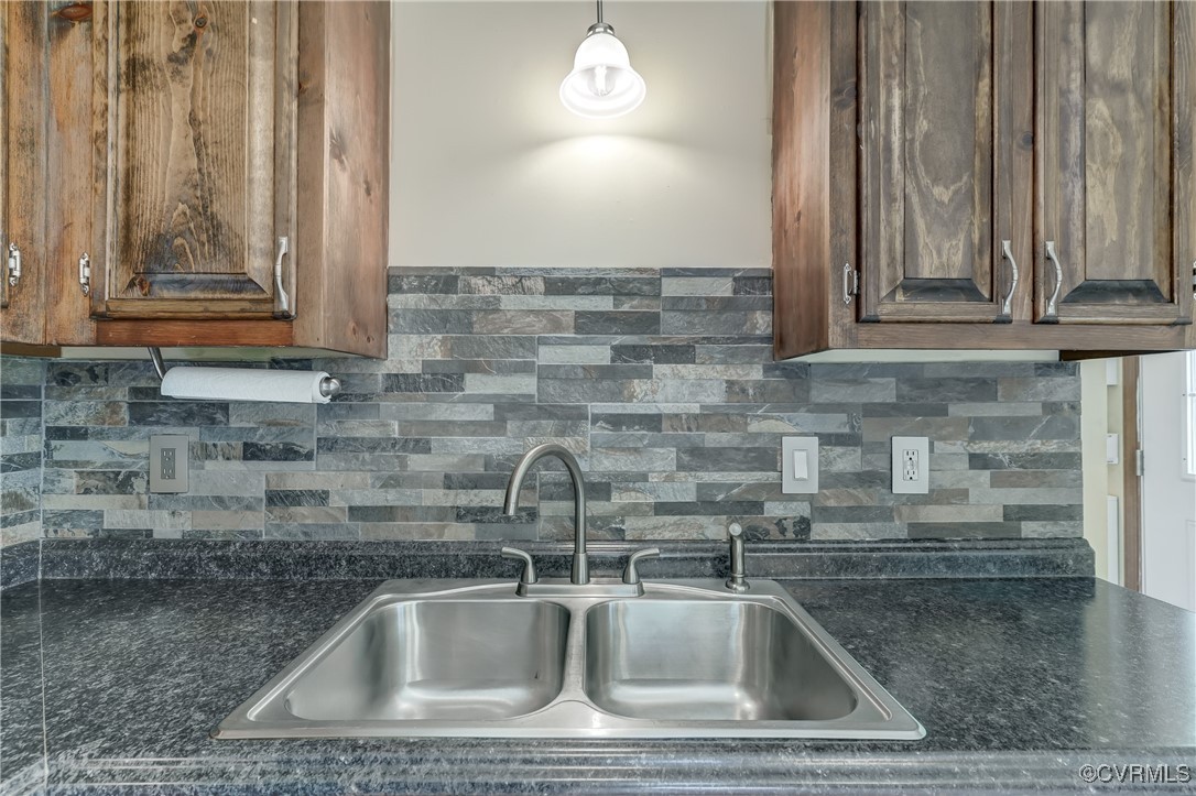 4509 Lockin Road Powhatan, VA 23139 - Photo 15 of 38 Kitchen featuring a sink, tasteful backsplash, and