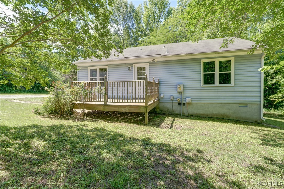 4509 Lockin Road Powhatan, VA 23139 - Photo 24 of 38 Rear view of property featuring a lawn, a deck, an