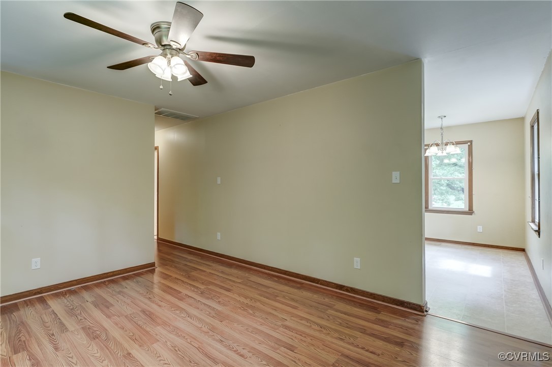 4509 Lockin Road Powhatan, VA 23139 - Photo 9 of 38 Empty room with a chandelier, ceiling fan, light w