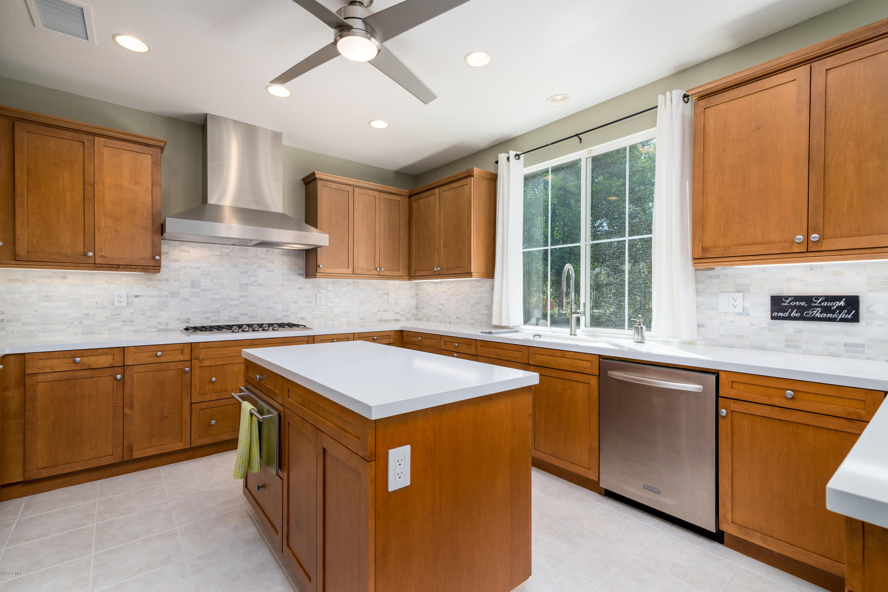 258 Spruce Circle Simi Valley, CA 93065 - Photo 11 of 46 a kitchen with stainless steel appliances granite countertop a sink stove and cabinets