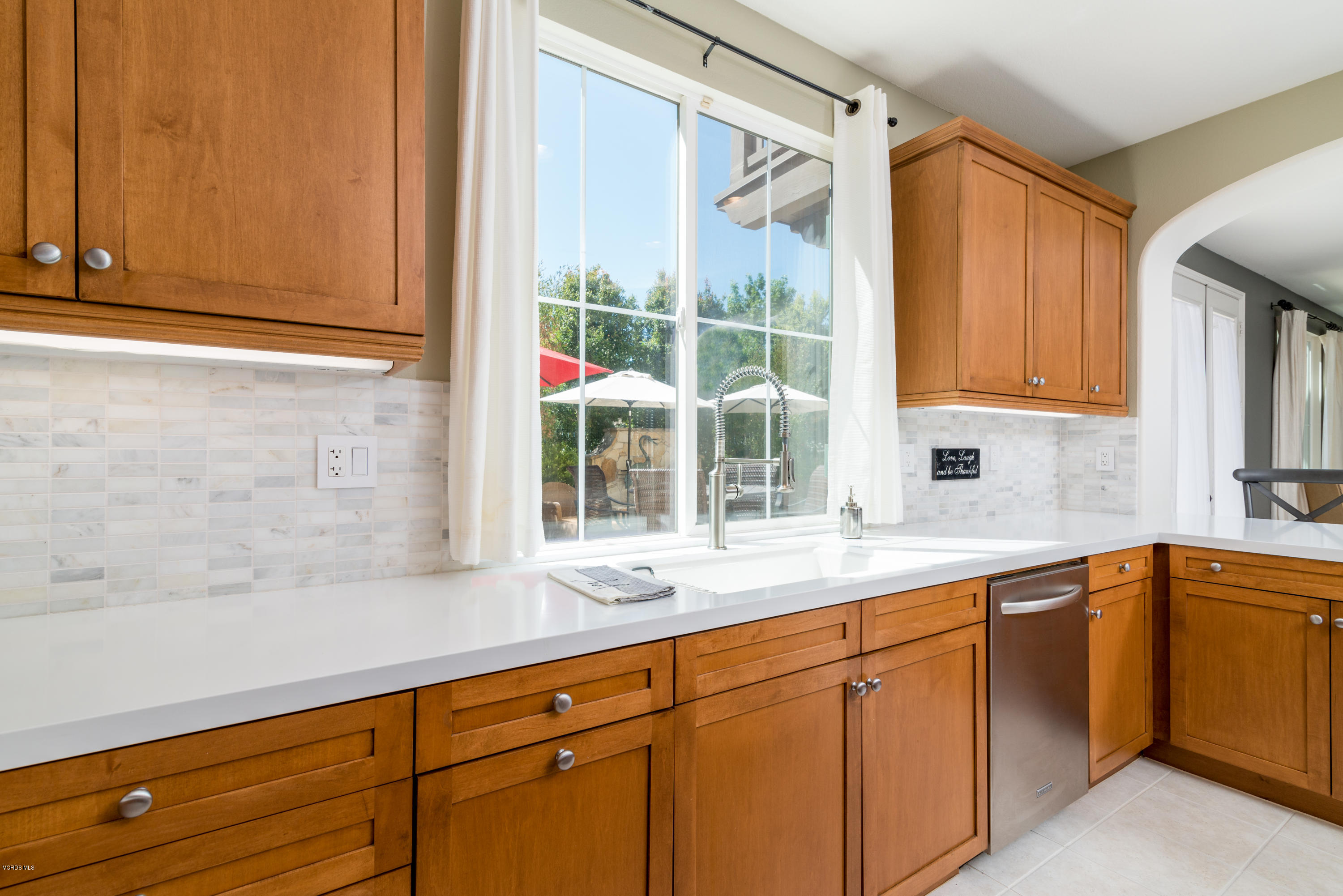 258 Spruce Circle Simi Valley, CA 93065 - Photo 12 of 46 a kitchen with a sink and cabinets