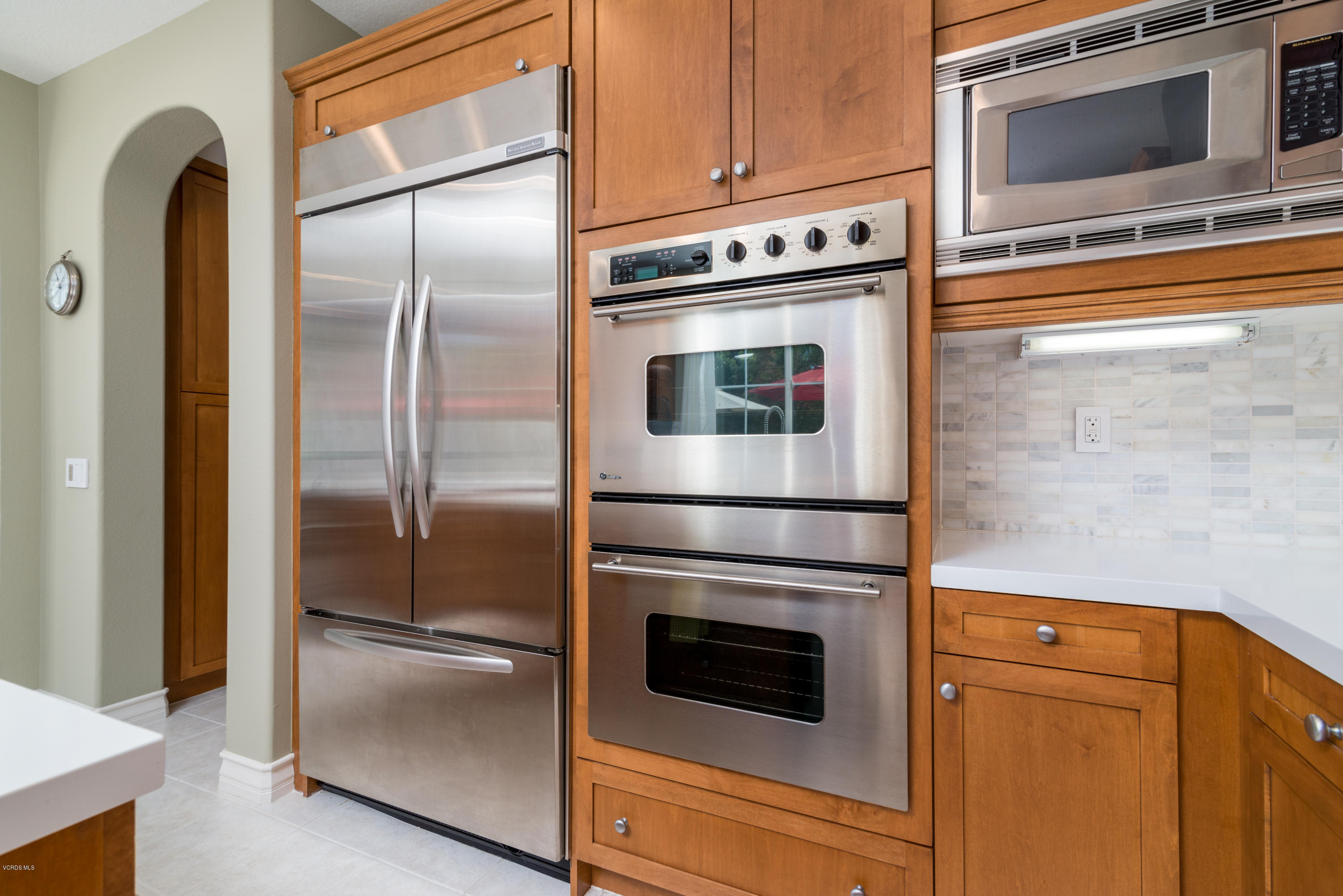 258 Spruce Circle Simi Valley, CA 93065 - Photo 14 of 46 a kitchen with a refrigerator stove and microwave