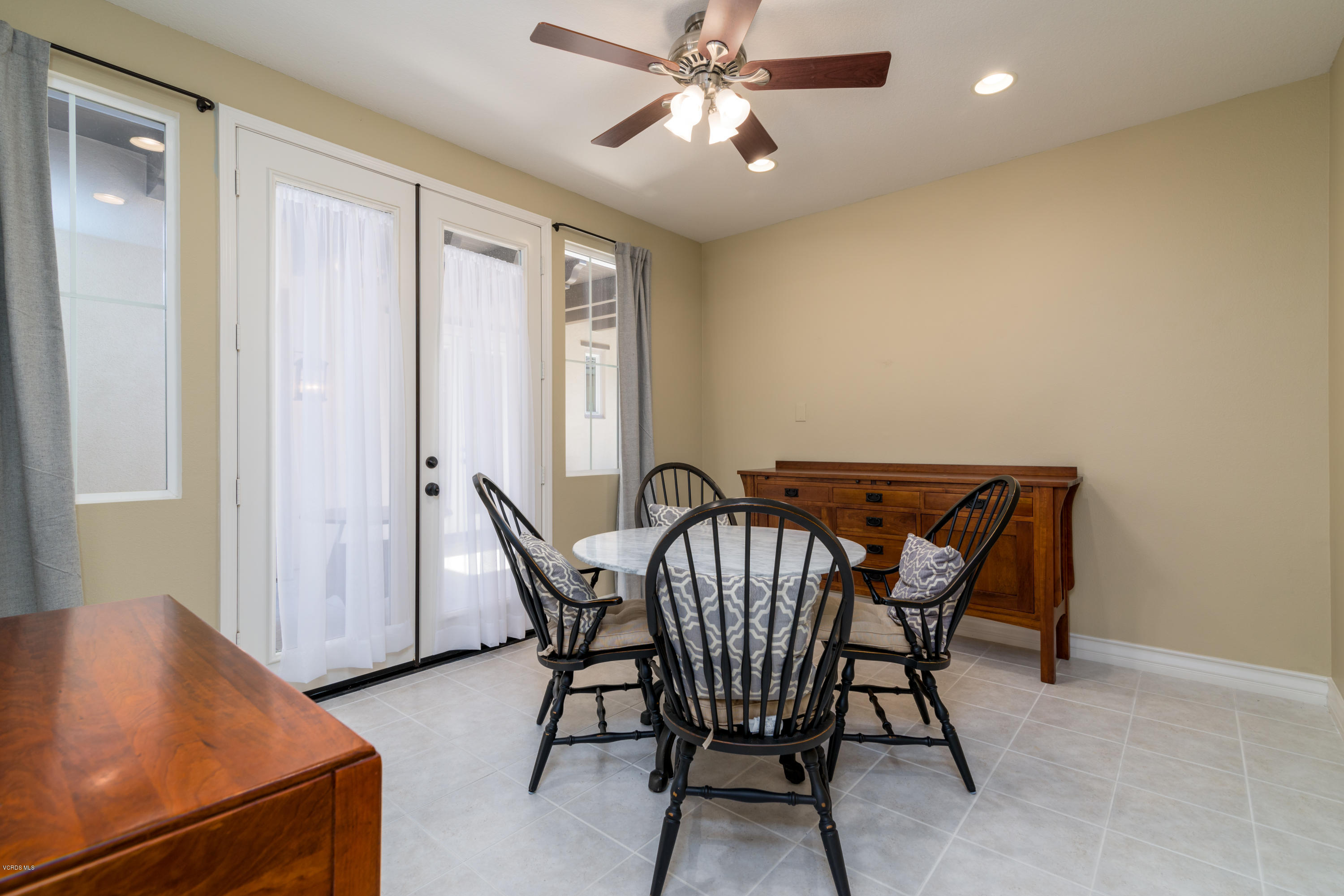258 Spruce Circle Simi Valley, CA 93065 - Photo 15 of 46 a view of a dining room with furniture and a window