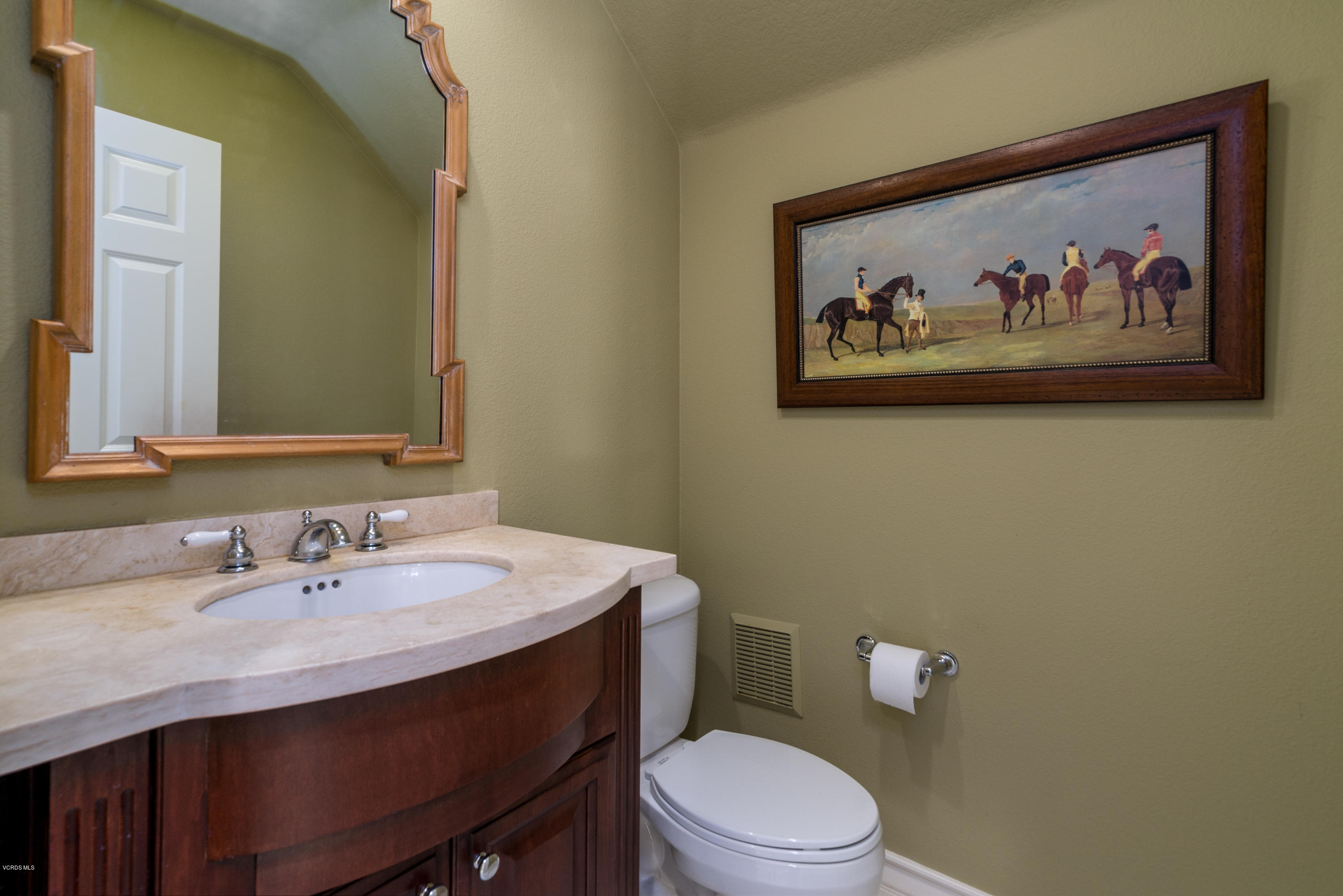 258 Spruce Circle Simi Valley, CA 93065 - Photo 17 of 46 a bathroom with a toilet a sink and mirror