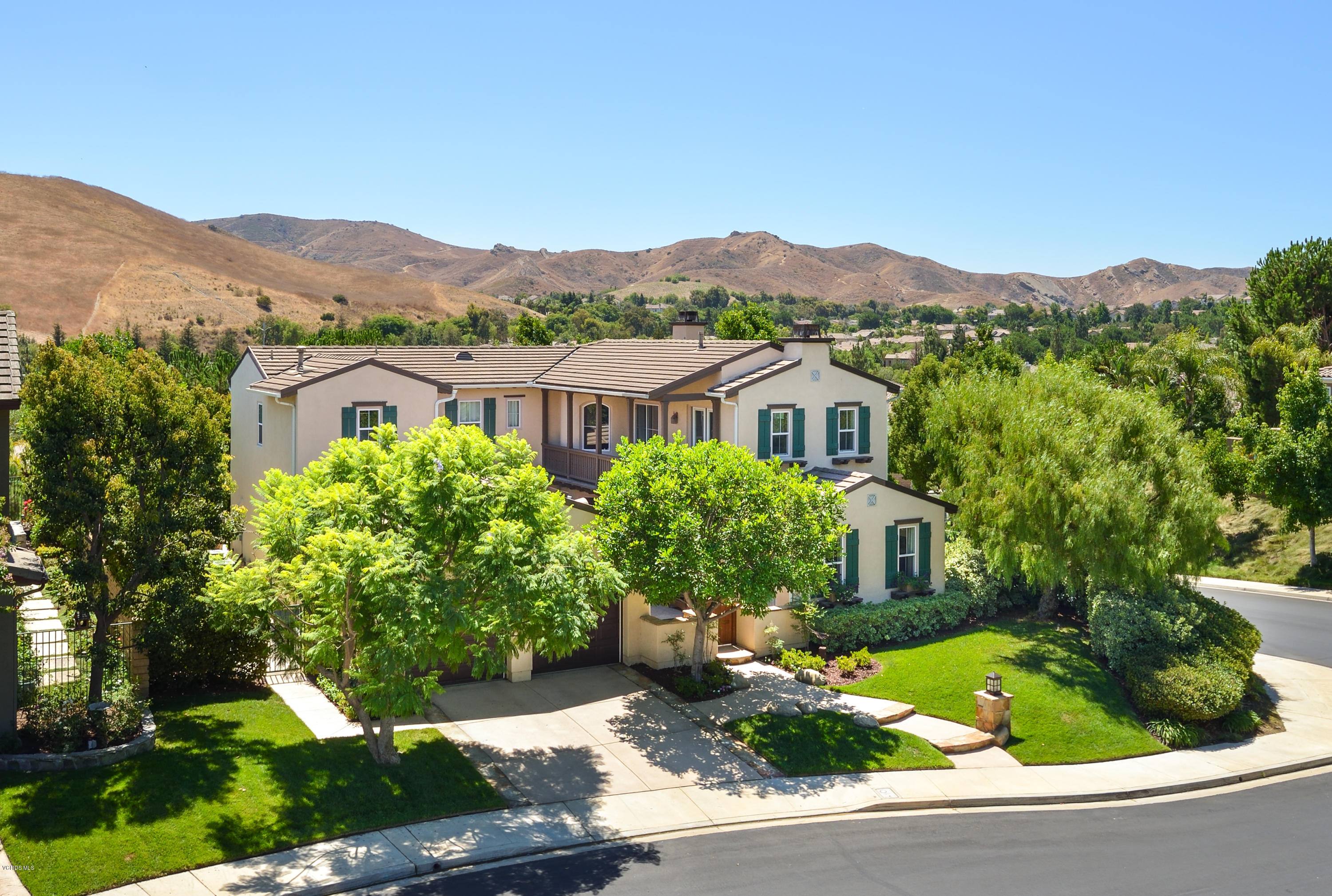 258 Spruce Circle Simi Valley, CA 93065 - Photo 3 of 46 a view of a house with a garden and a mountain view
