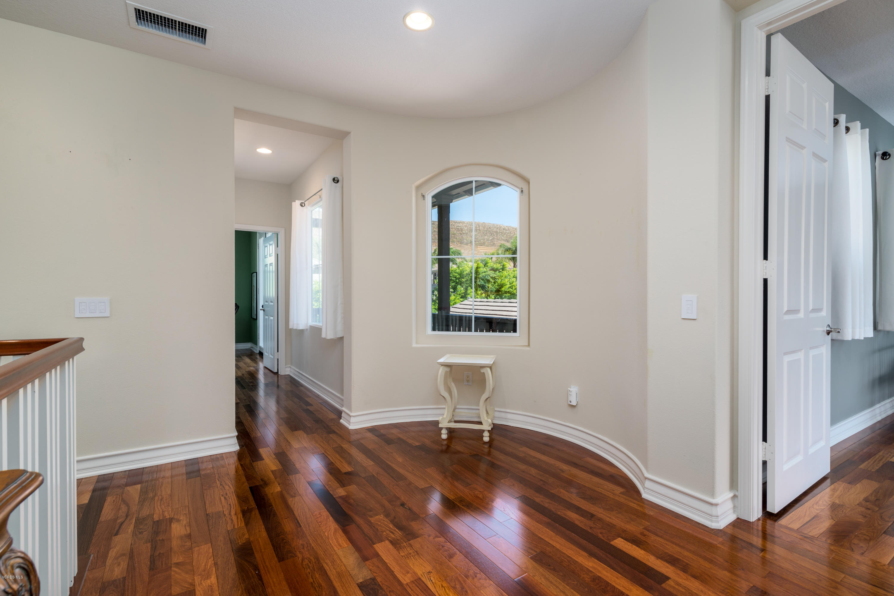 258 Spruce Circle Simi Valley, CA 93065 - Photo 21 of 46 a view of empty room with wooden floor and fan