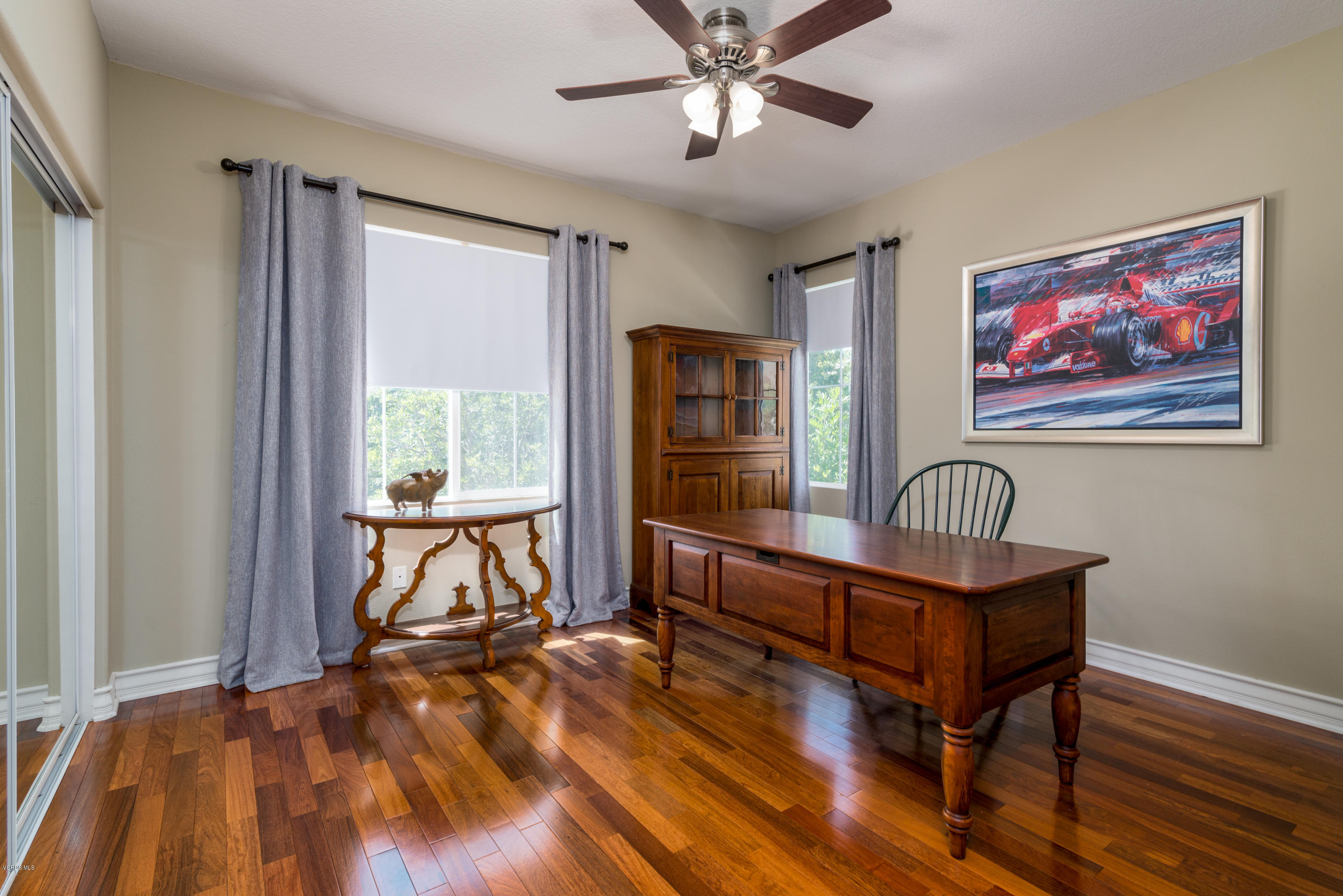258 Spruce Circle Simi Valley, CA 93065 - Photo 26 of 46 a bedroom with furniture window and wooden floor