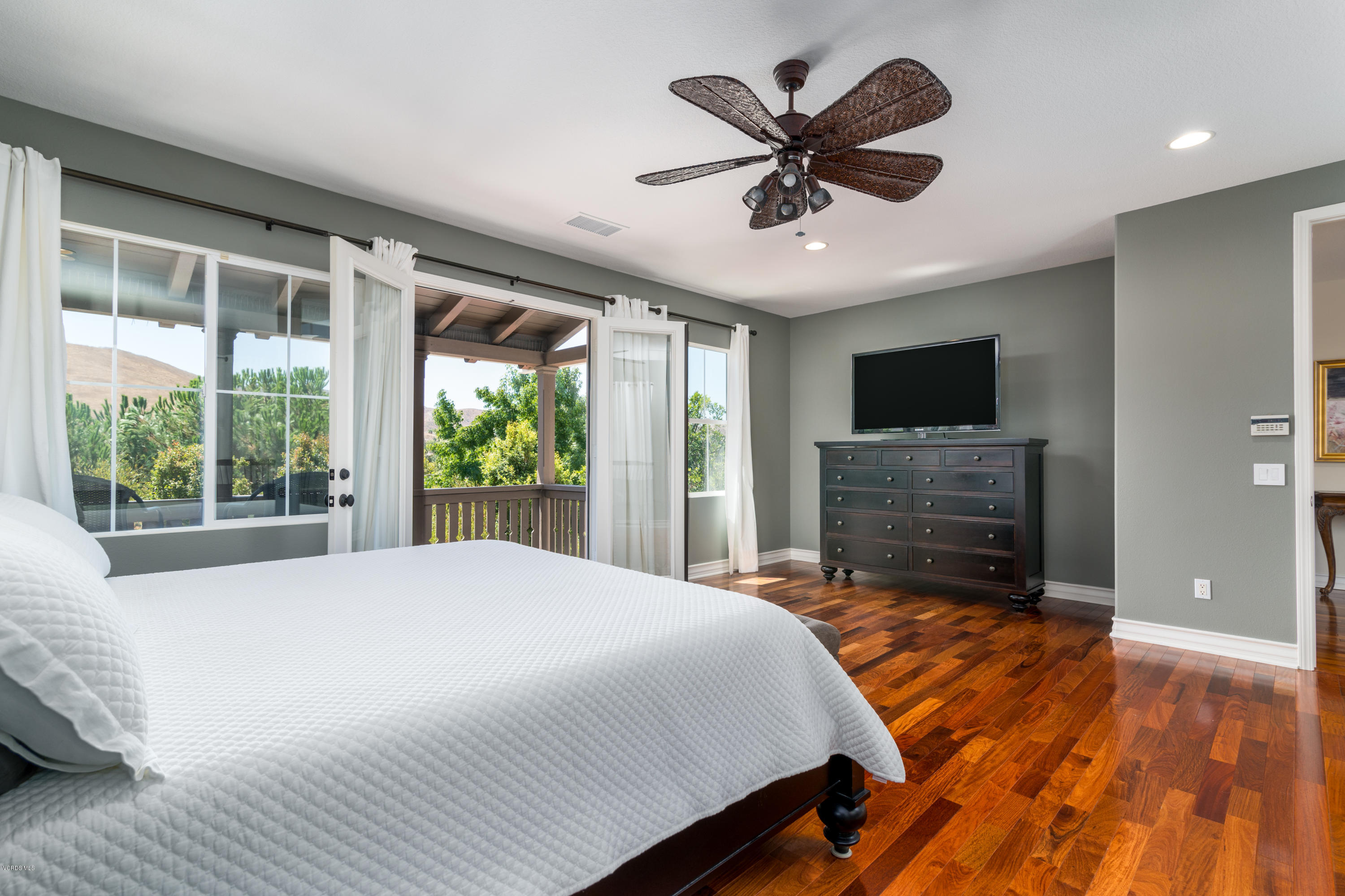 258 Spruce Circle Simi Valley, CA 93065 - Photo 29 of 46 a bedroom with a bed and a flat screen tv