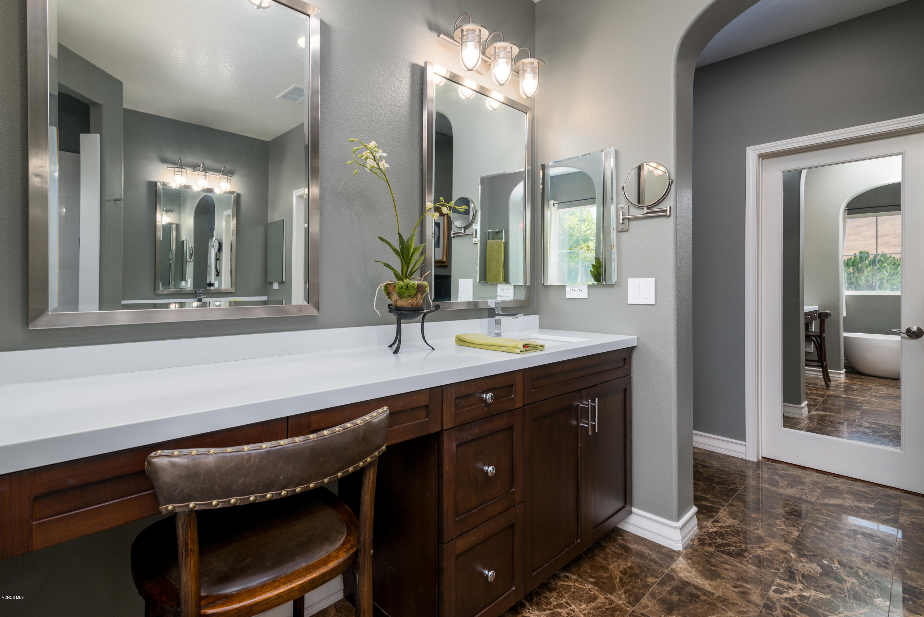 258 Spruce Circle Simi Valley, CA 93065 - Photo 34 of 46 a bathroom with a sink a light fixture and a mirror