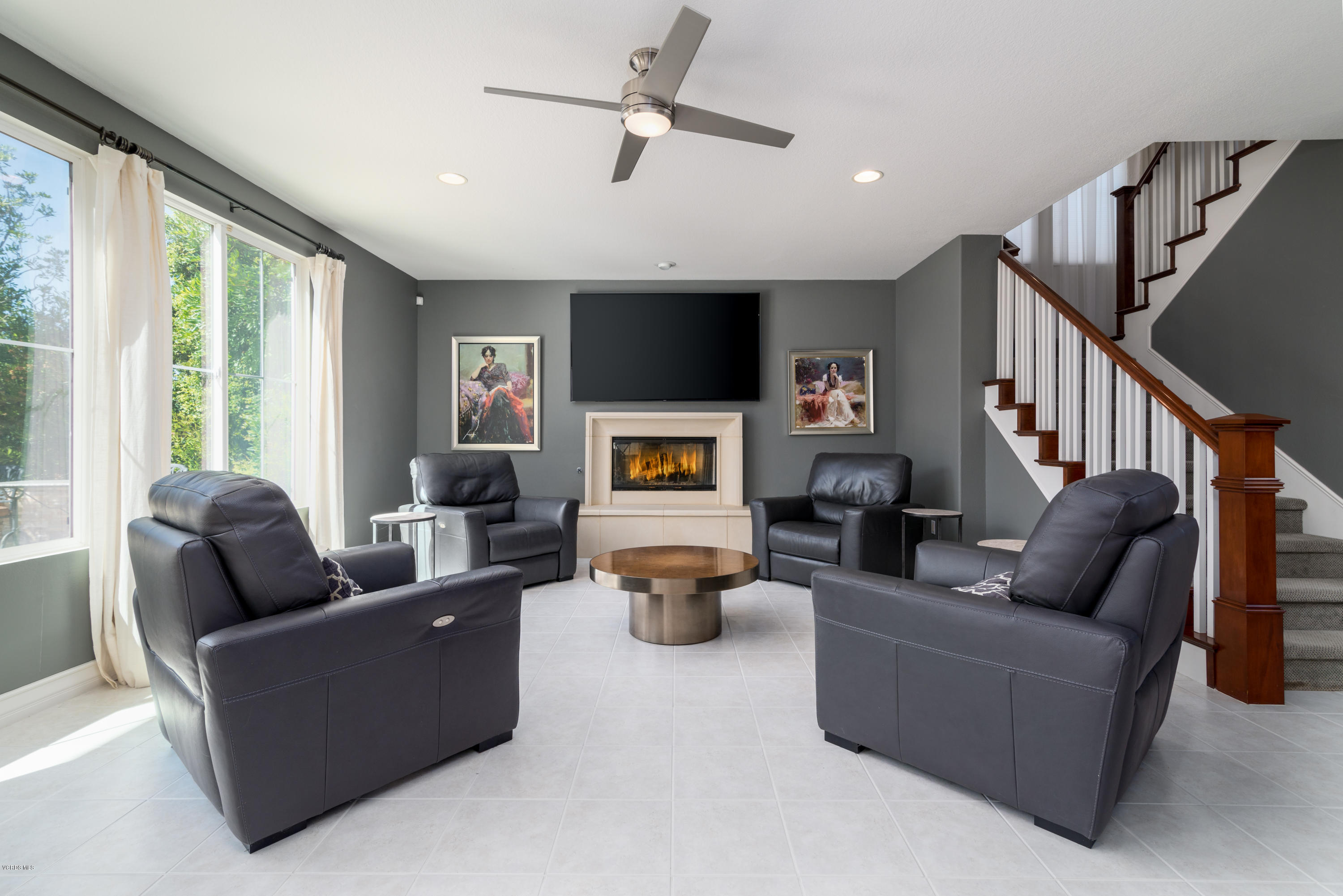 258 Spruce Circle Simi Valley, CA 93065 - Photo 6 of 46 a living room with fireplace furniture and a large window
