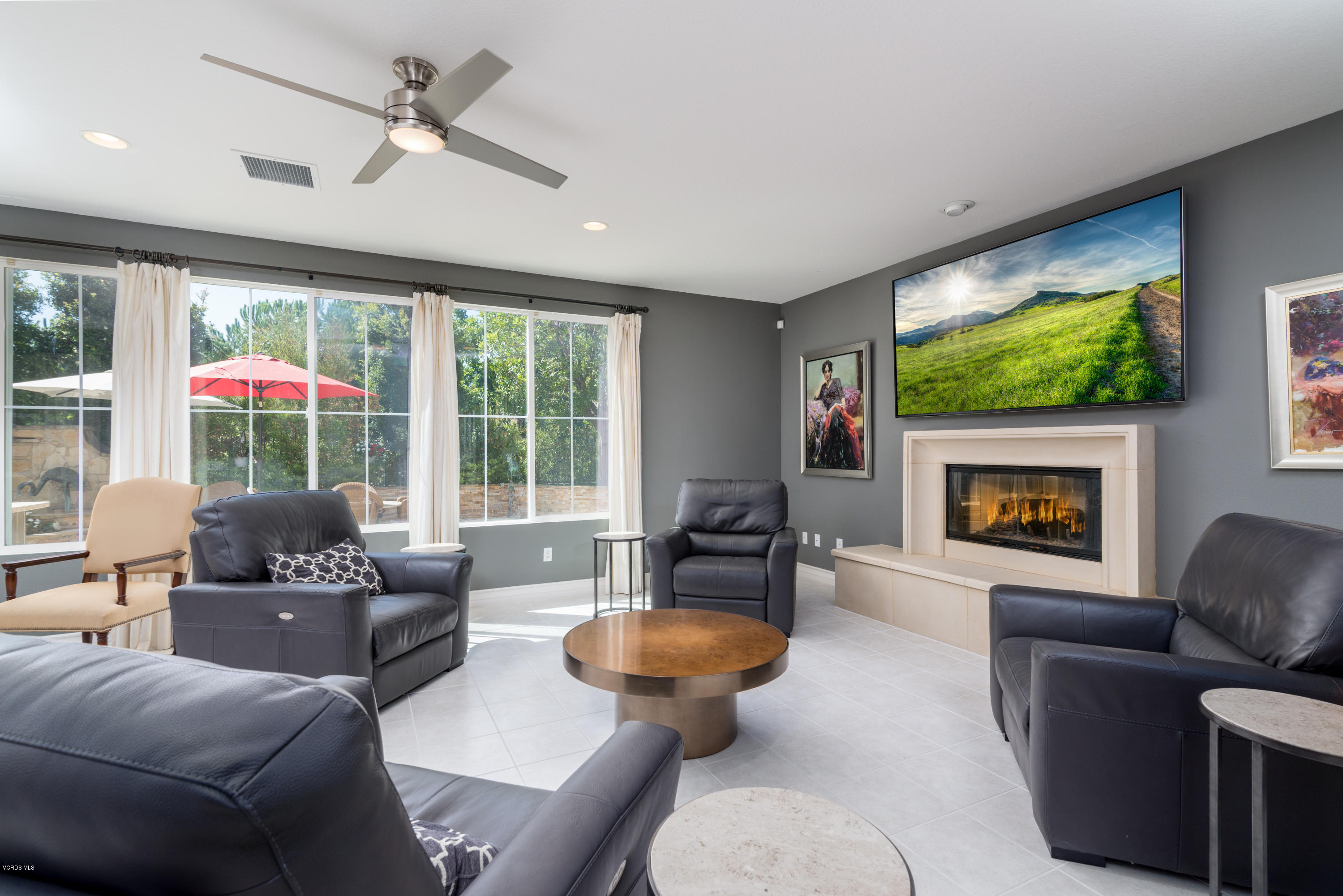 258 Spruce Circle Simi Valley, CA 93065 - Photo 7 of 46 a living room with furniture a fireplace and a large window