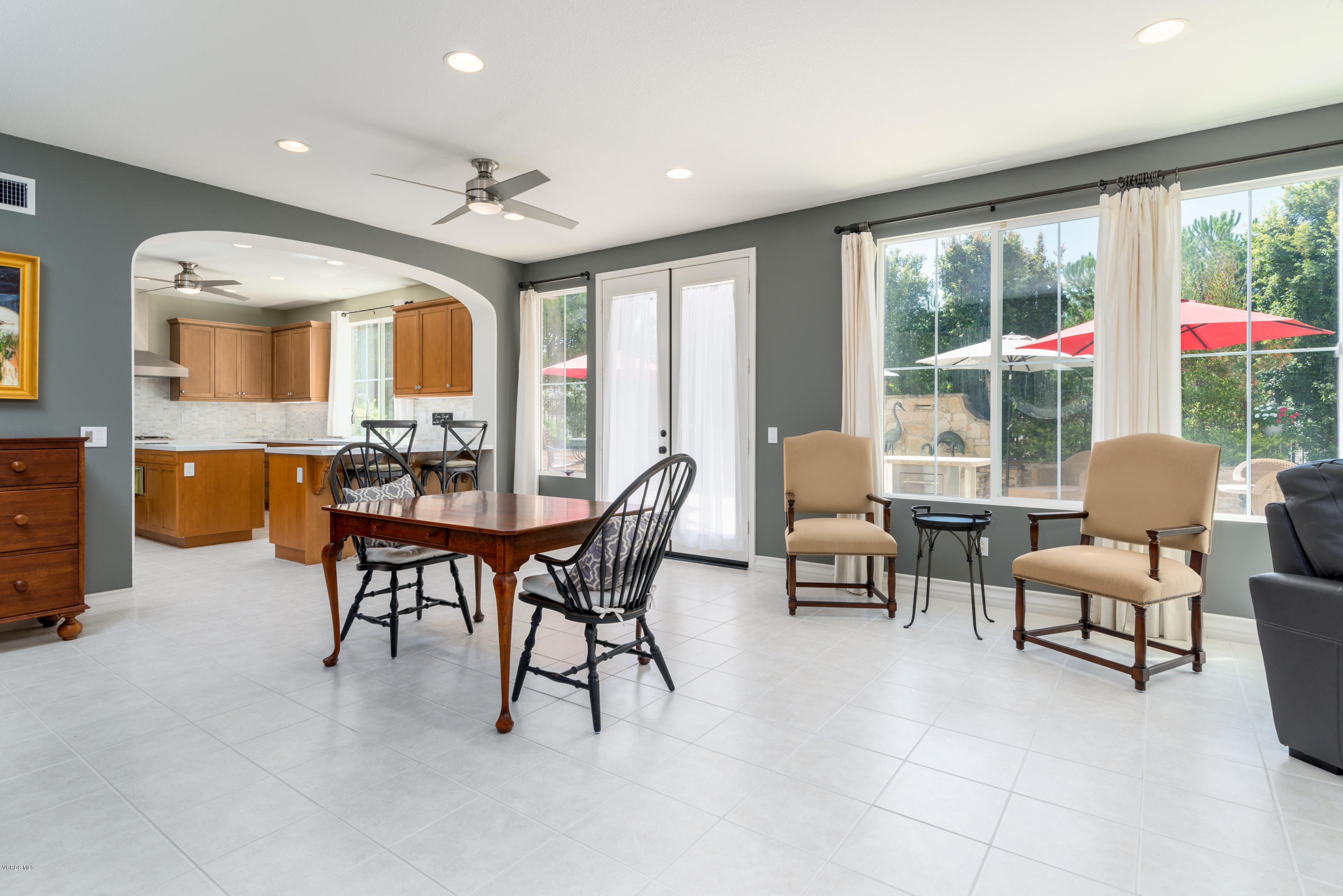 258 Spruce Circle Simi Valley, CA 93065 - Photo 9 of 46 a dining room with furniture and large windows