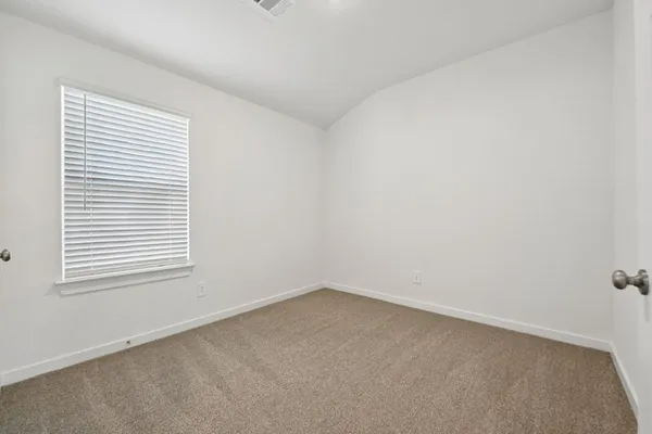 an empty room with closet area