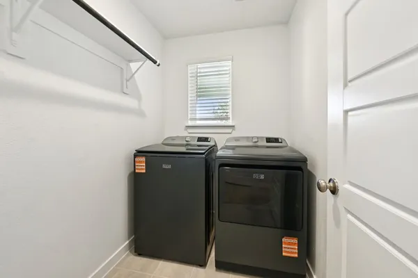 a utility room with washer and dryer