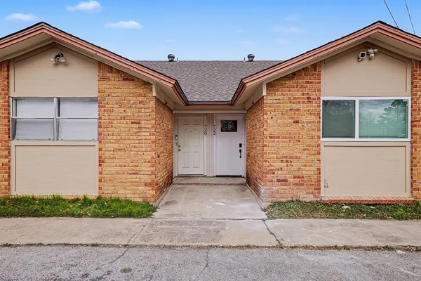 a front view of a house with a garage