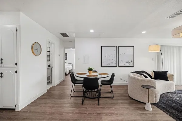 a workspace with furniture and wooden floor