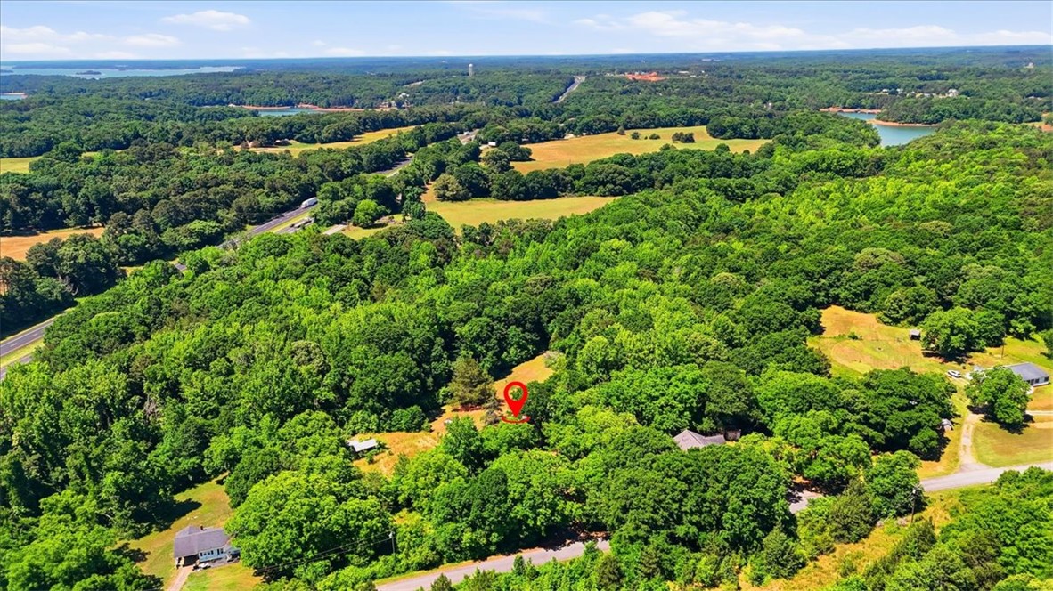 1014 Harris Road Anderson, SC 29625 - Photo 31 of 34 An aerial perspective reveals a private, heavily wooded acreage with partial water and highway views.