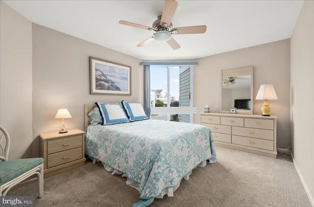 a bed room with a bed and a dresser