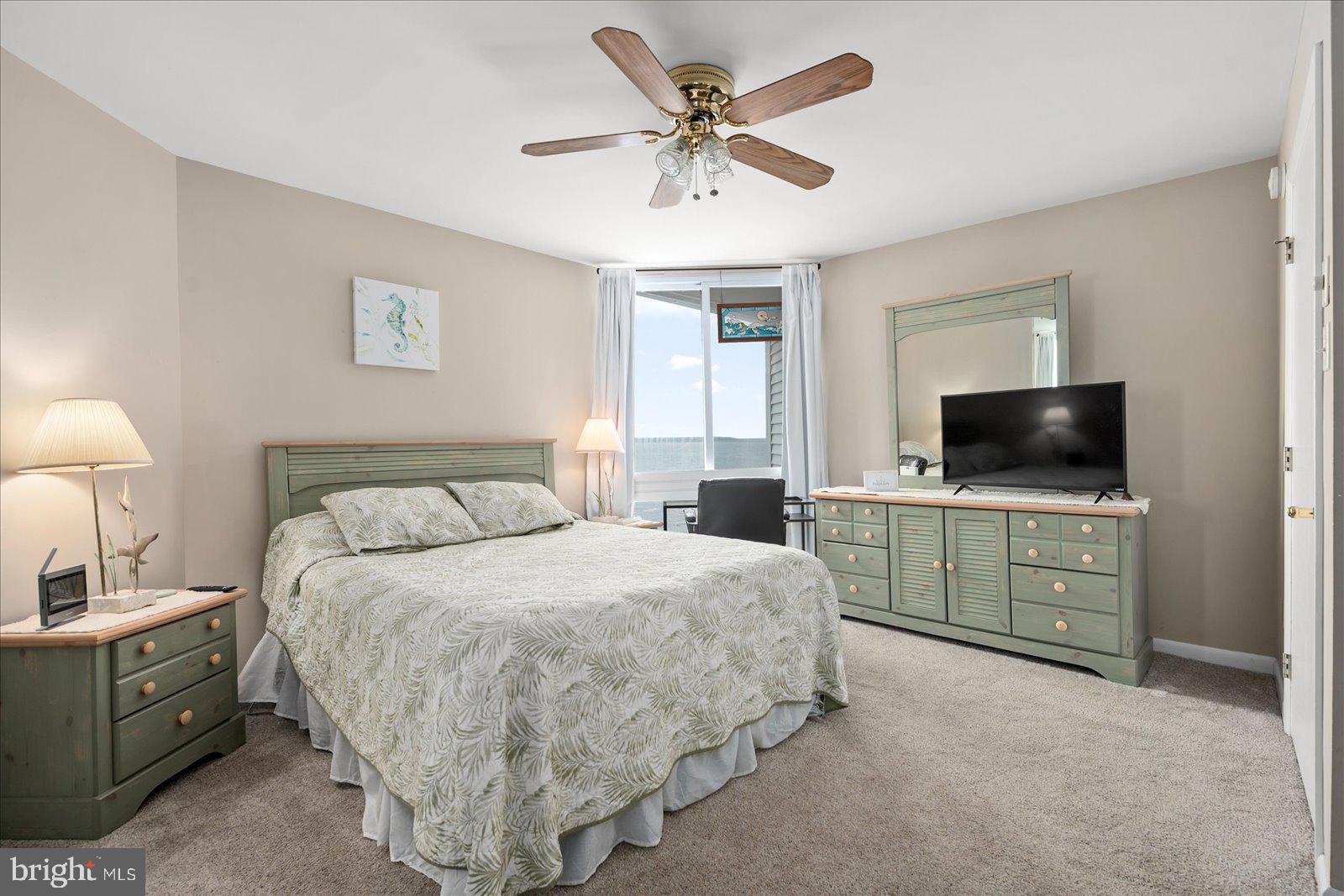 775 94th Street, Unit 775 Ocean City, MD 21842 - Photo 25 of 57 a bed room with a bed and a television