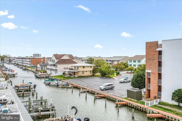 a view of a lake with tall buildings