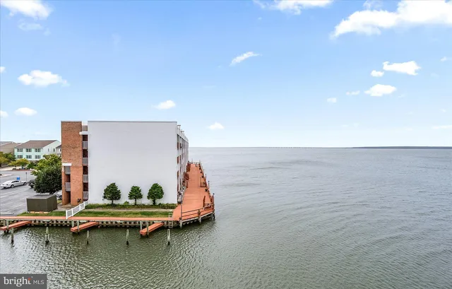 a living room with furniture a rug and a table