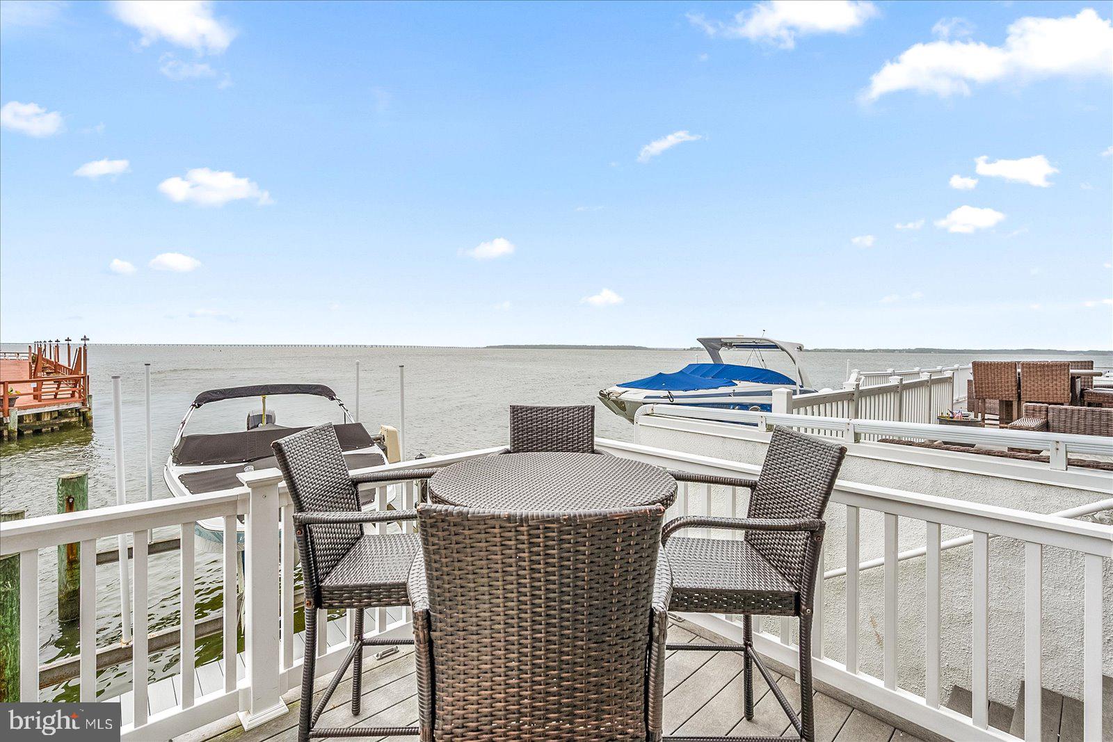 775 94th Street, Unit 775 Ocean City, MD 21842 - Photo 44 of 57 a view of a dining room with furniture and chandelier