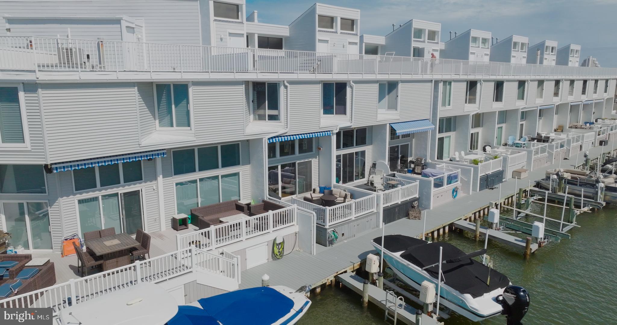 775 94th Street, Unit 775 Ocean City, MD 21842 - Photo 55 of 57 a view of a building with outdoor seating