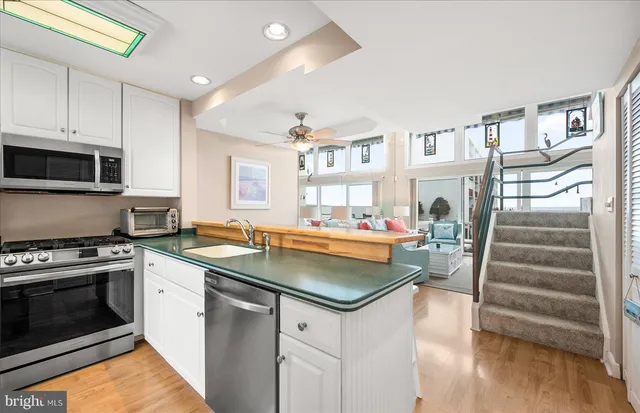 a kitchen with cabinets and a stove