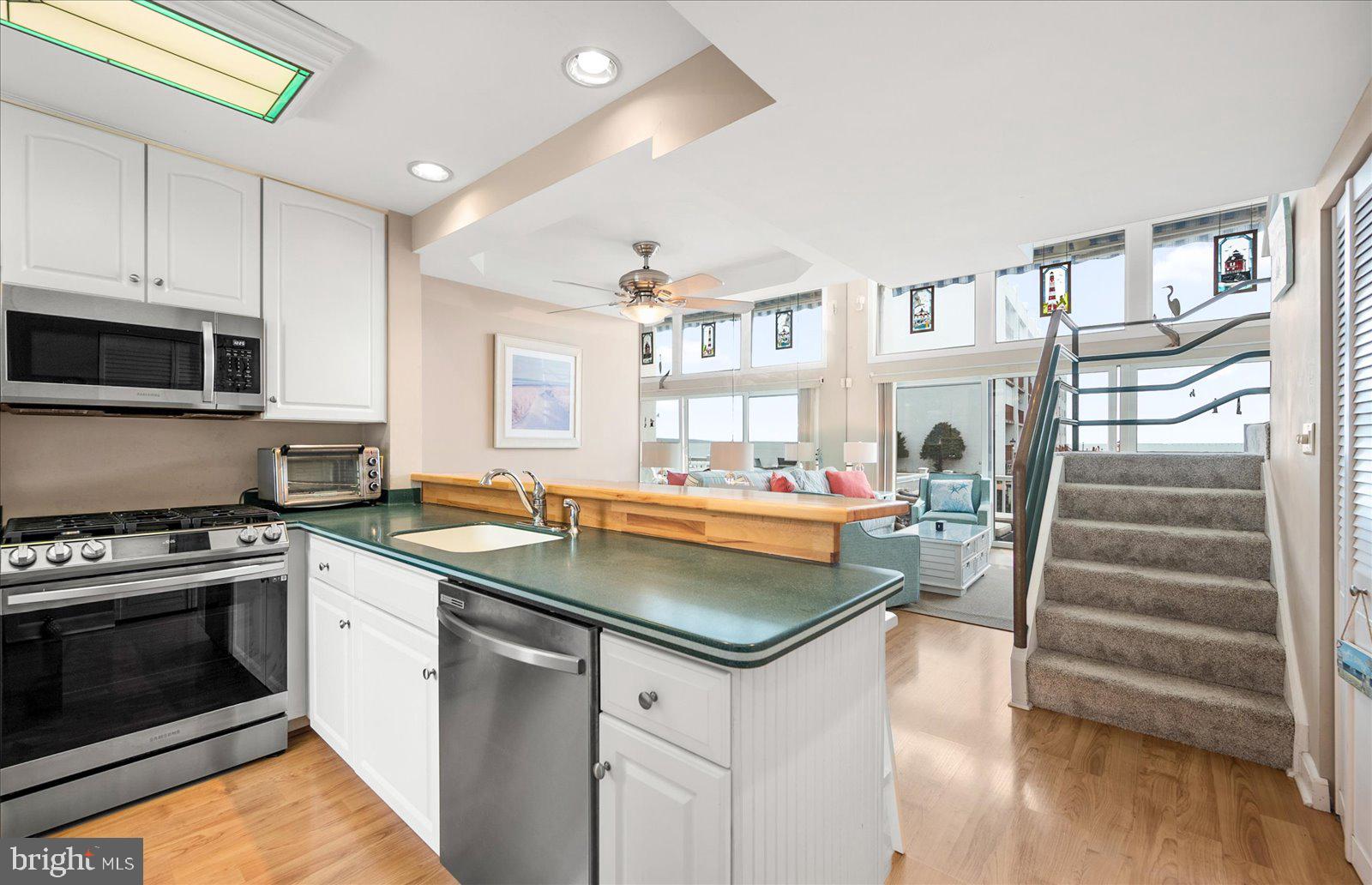 775 94th Street, Unit 775 Ocean City, MD 21842 - Photo 7 of 57 a kitchen with cabinets and a stove