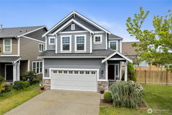 a view of a house with a yard and plants