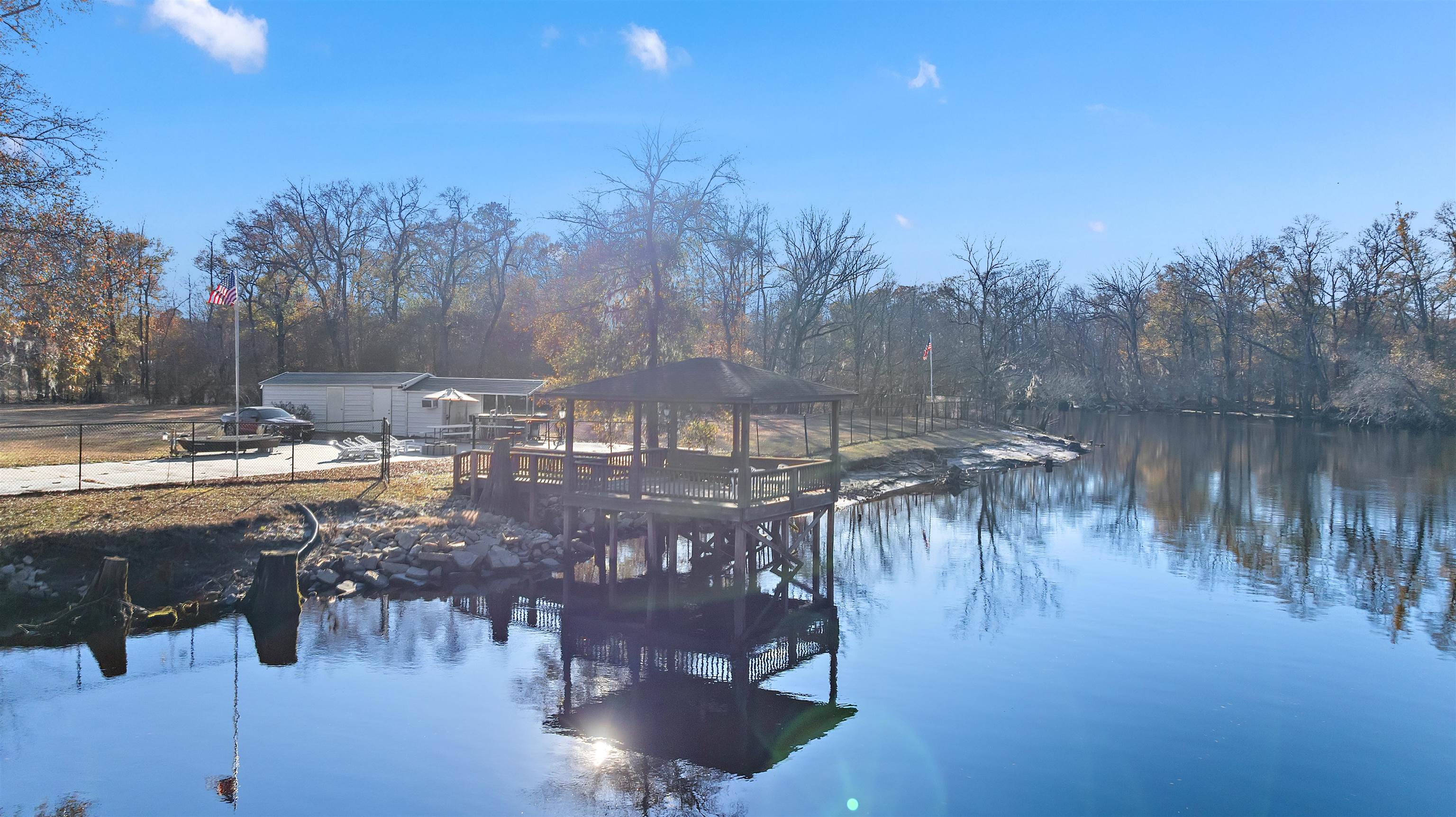 3429 River Road Nichols, SC 29581 - Photo 2 of 26 View from the river featuring a gazebo and a boat ramp