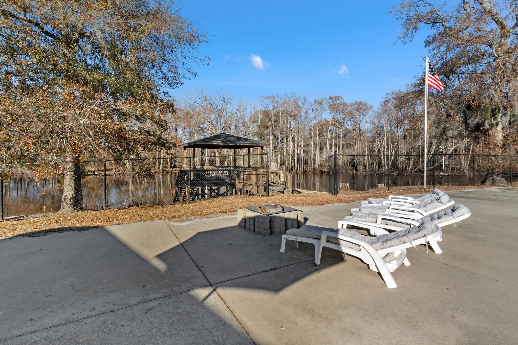 3429 River Road Nichols, SC 29581 - Photo 25 of 46 View of patio area featuring a gazebo and an outdoor fire pit