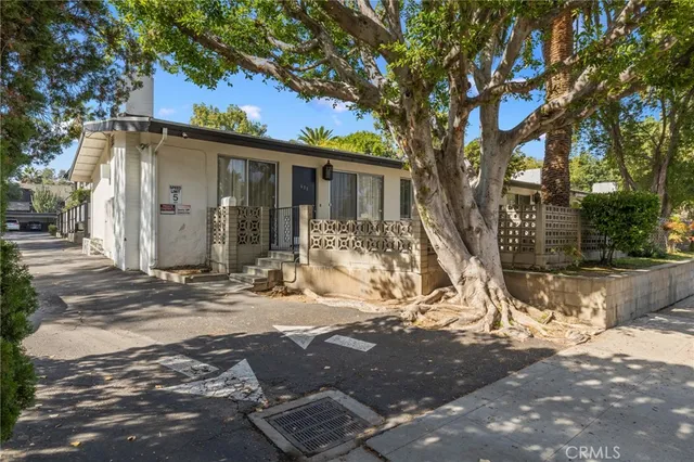 a view of a house with snow on the background