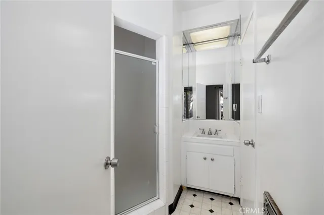 a bathroom with a sink and mirror