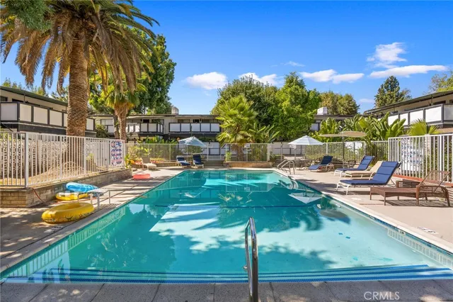 a view of a swimming pool with a patio