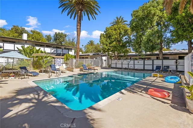 an aerial view of a house with a yard and garden
