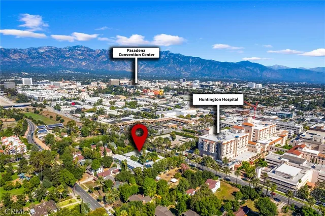 a view of a city with mountains in the background