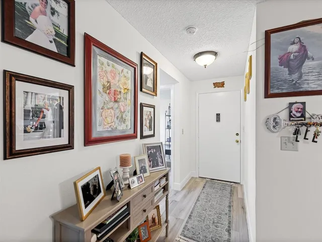 a view of a livingroom with furniture and workspace