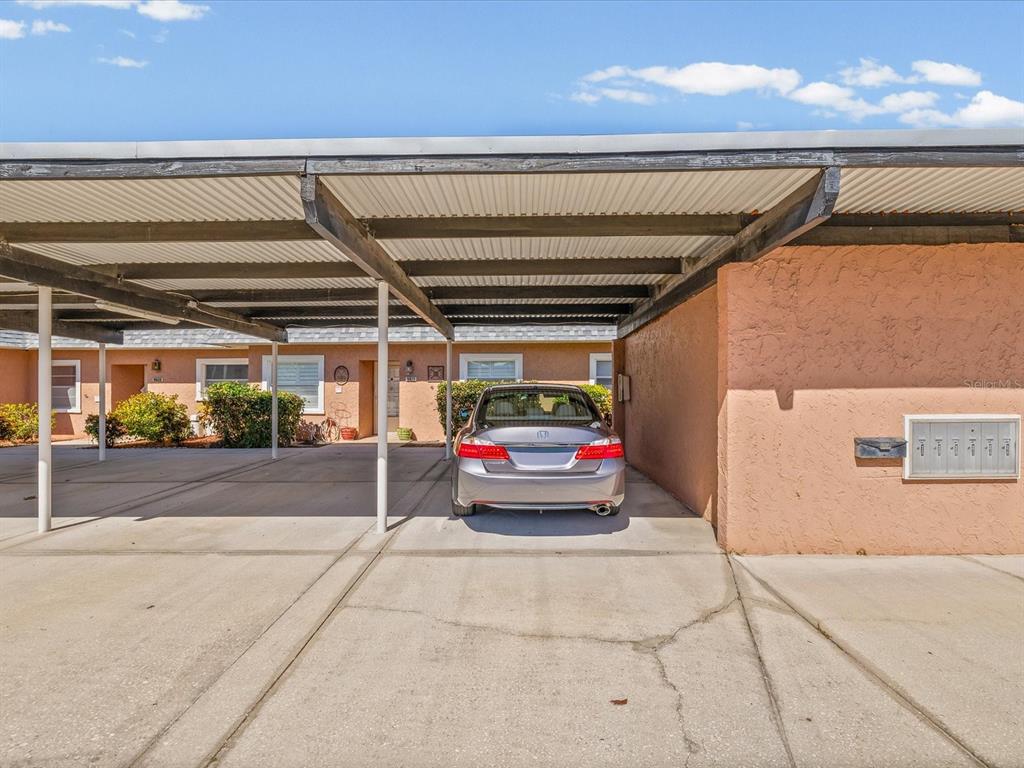 9615 Midiron Court, Unit 9615 New Port Richey, FL 34655 - Photo 28 of 36 a view of garage with car parked