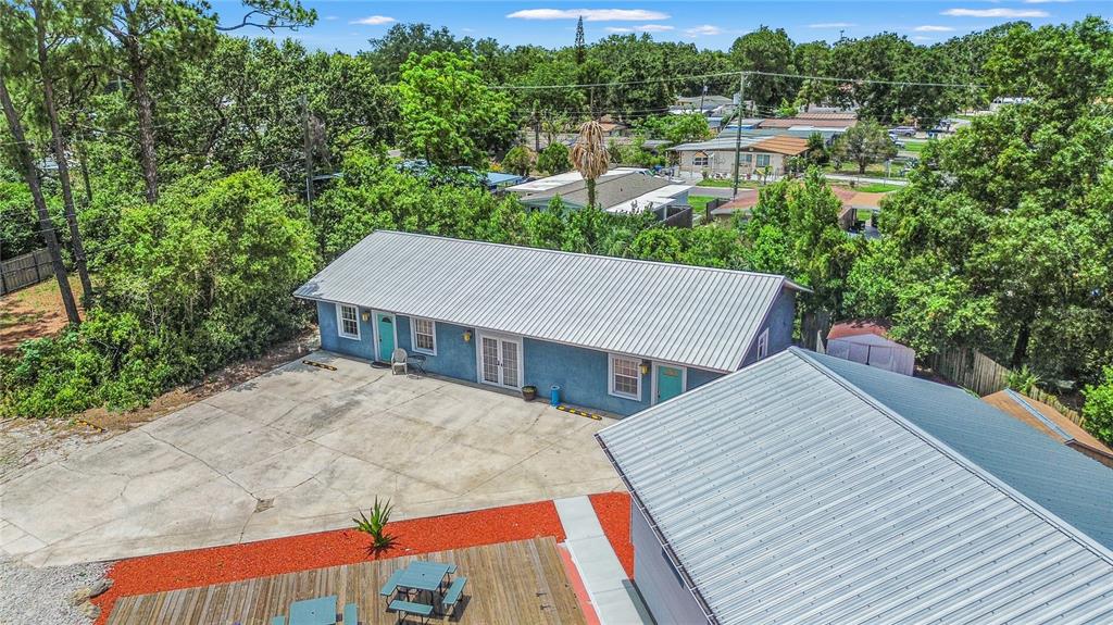 6515 Dimarco Road Tampa, FL 33634 - Photo 36 of 66 a view of house with outdoor space and sitting area
