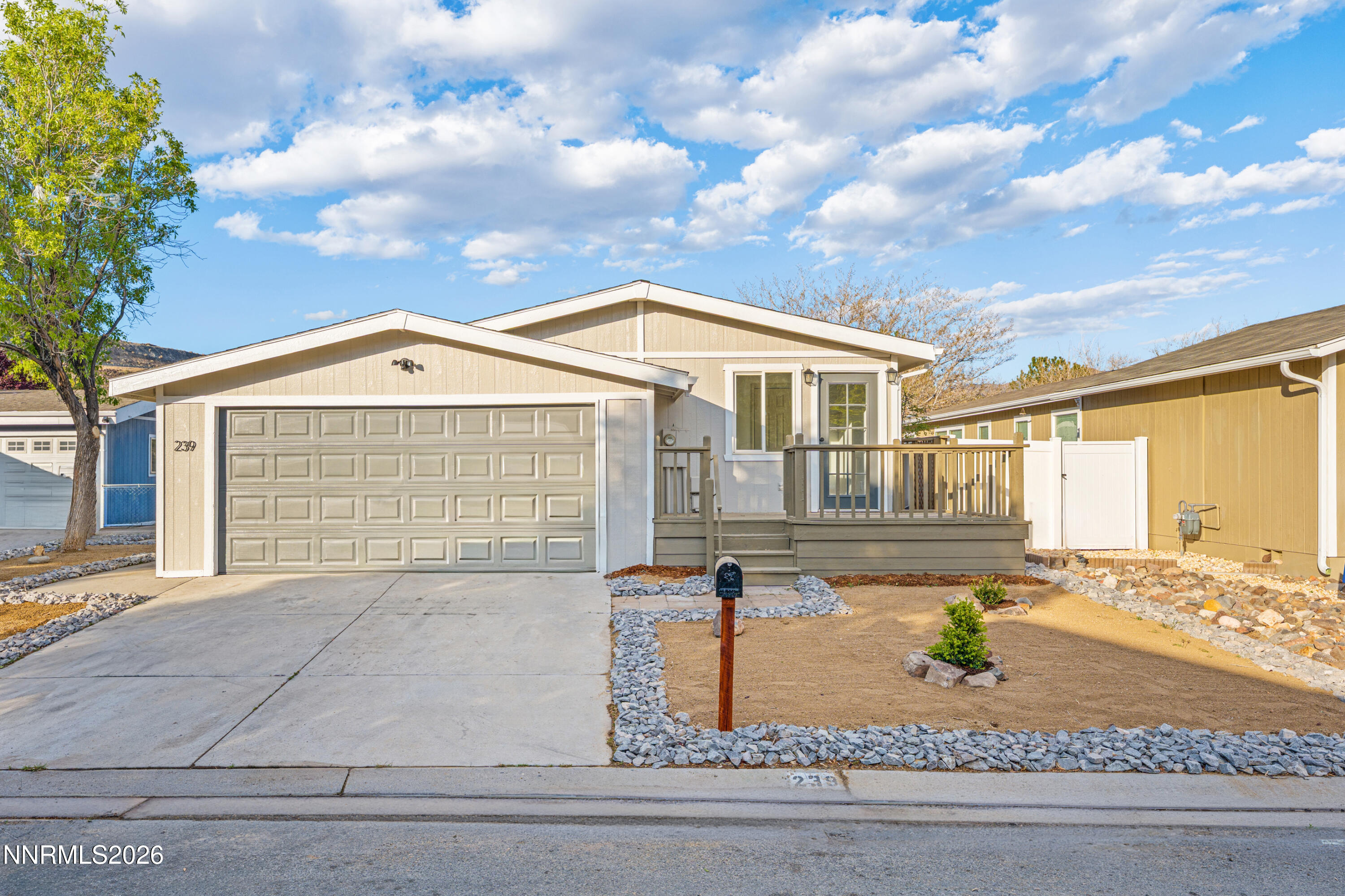 239 Rue De La Chartreuse Sparks, NV 89434 - Photo 1 of 24 a front view of a house with a yard
