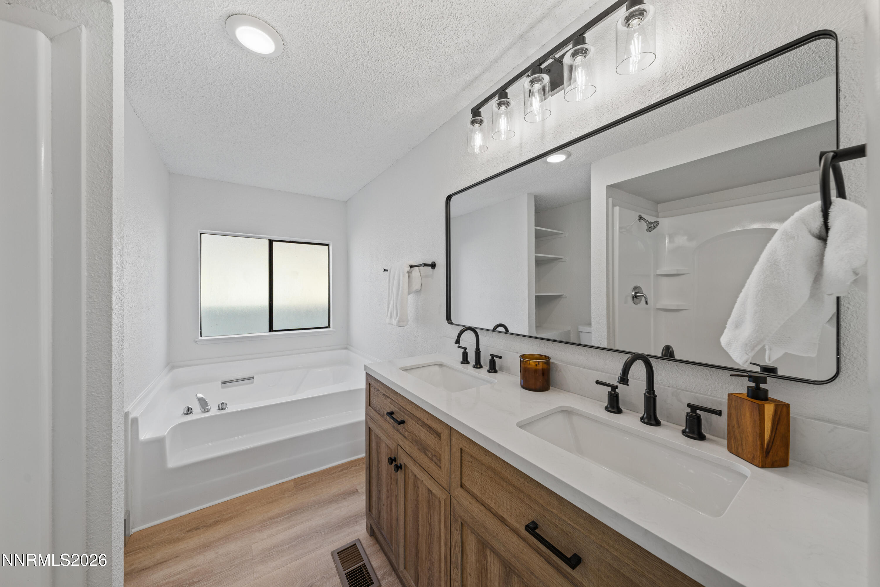 239 Rue De La Chartreuse Sparks, NV 89434 - Photo 11 of 24 a bathroom with double vanity sink and a mirror