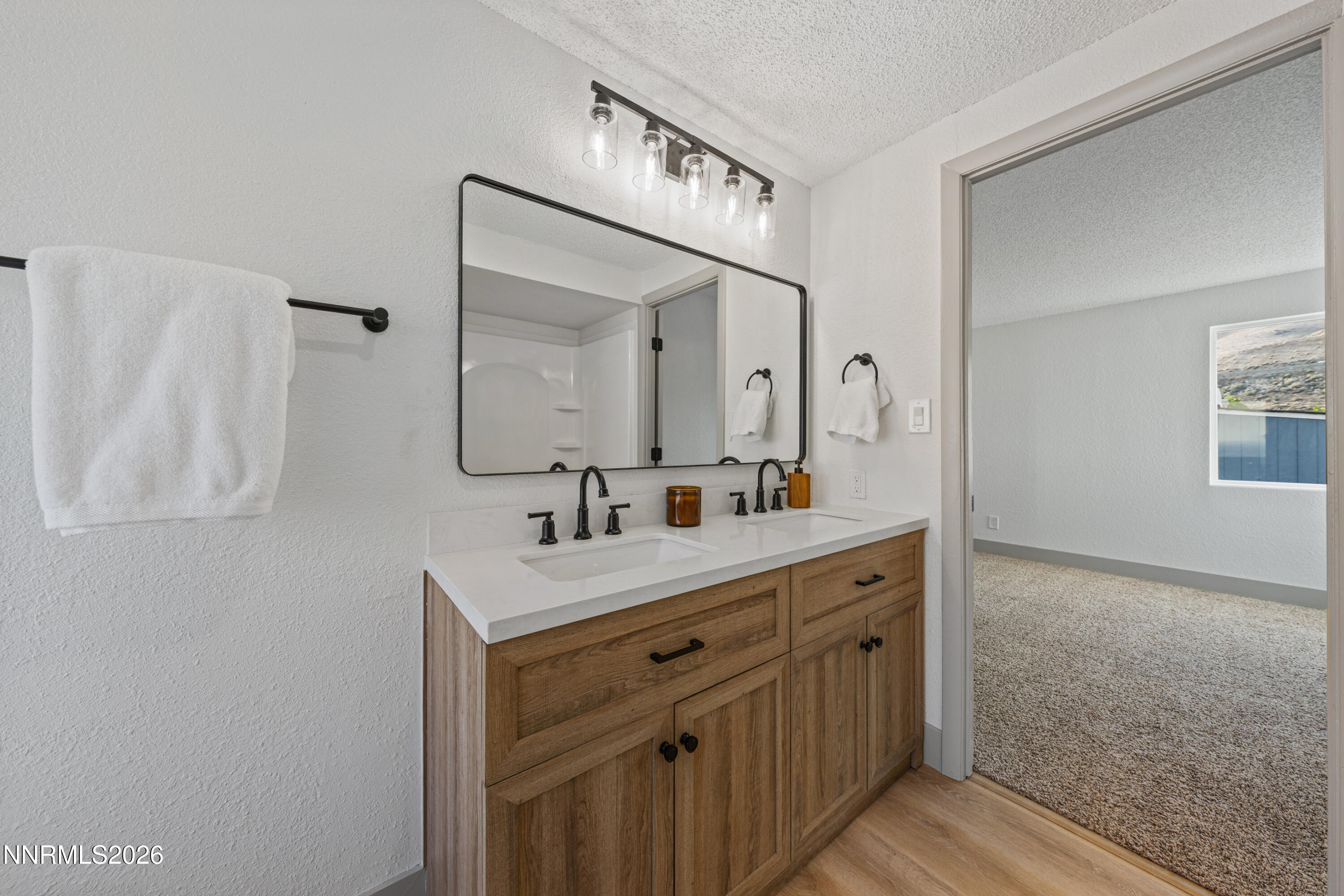 239 Rue De La Chartreuse Sparks, NV 89434 - Photo 13 of 24 a bathroom with a sink a mirror and a vanity