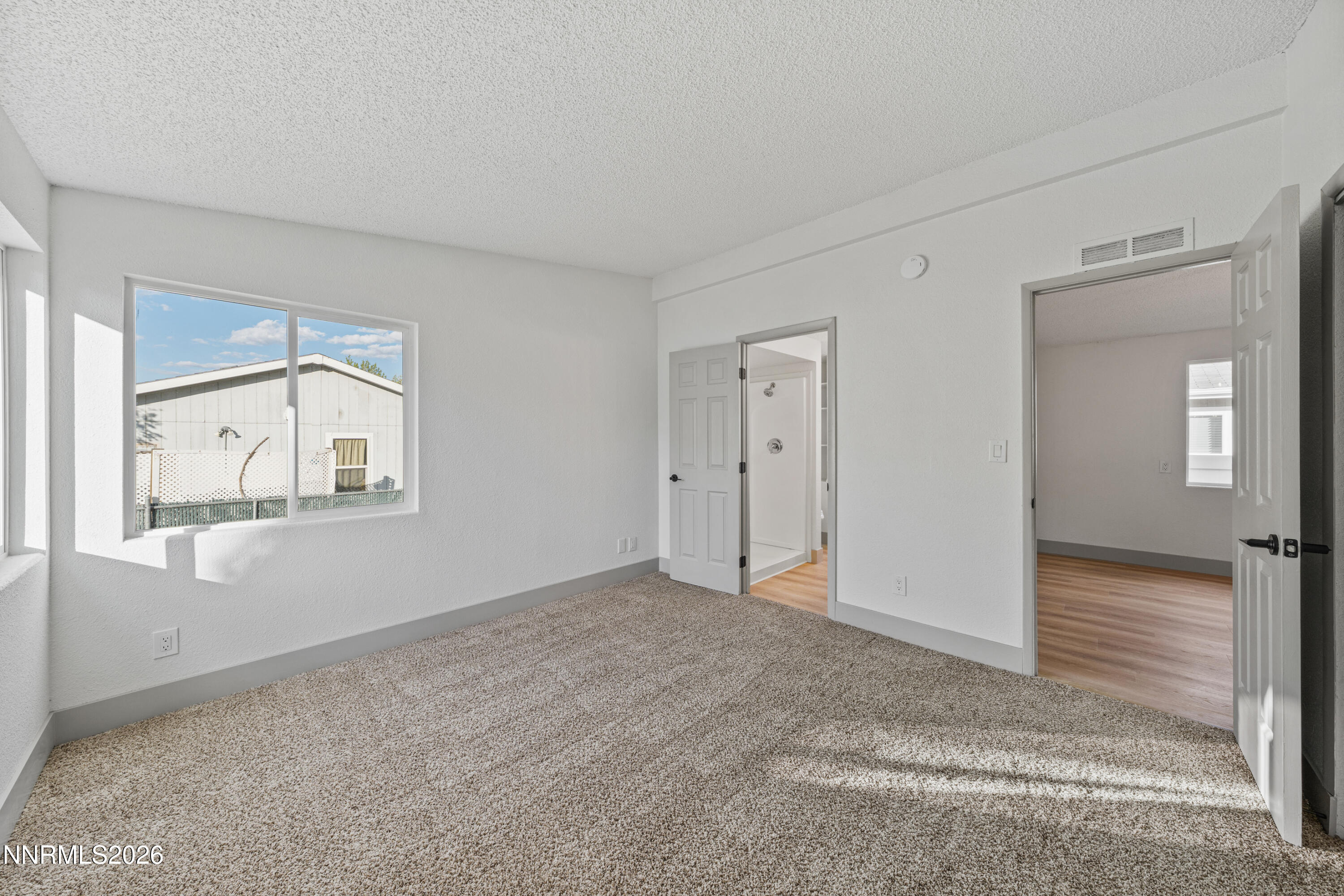 239 Rue De La Chartreuse Sparks, NV 89434 - Photo 15 of 24 an empty room with windows and closet