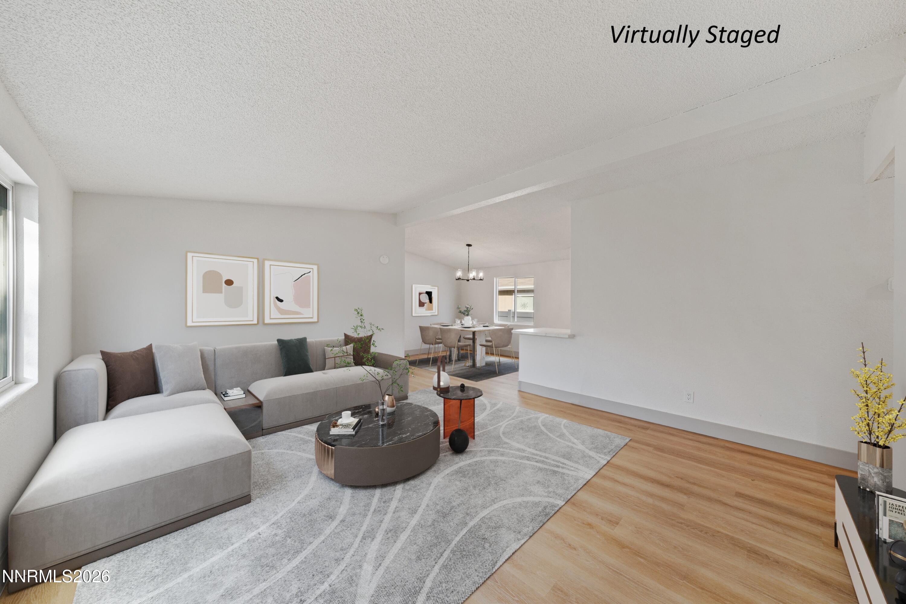 239 Rue De La Chartreuse Sparks, NV 89434 - Photo 4 of 24 a living room with furniture and a couch